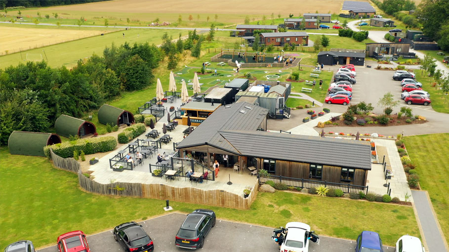Aerial drone video with view of a restaurant on a holiday park in Teesside, showcasing layout and surroundings