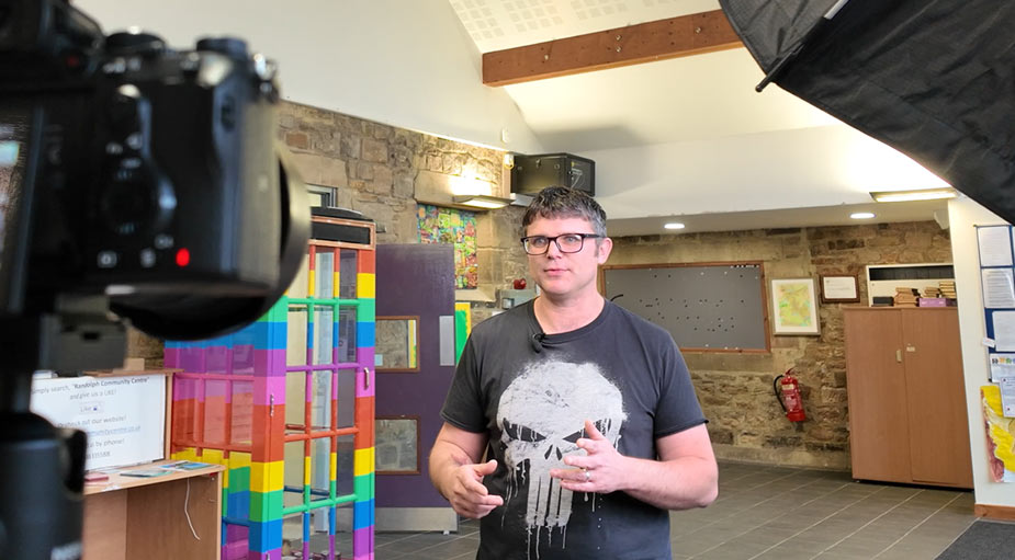 Behind-the-scenes interview filming with professional lighting setup by Tees Vision Media.