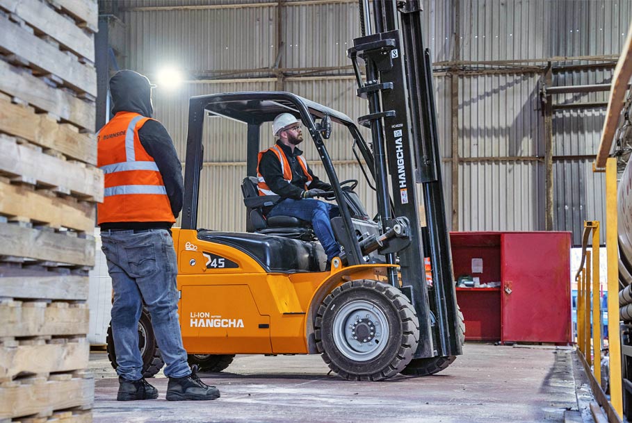 Branding photography of staff operating forklift in industrial unit in Teesside