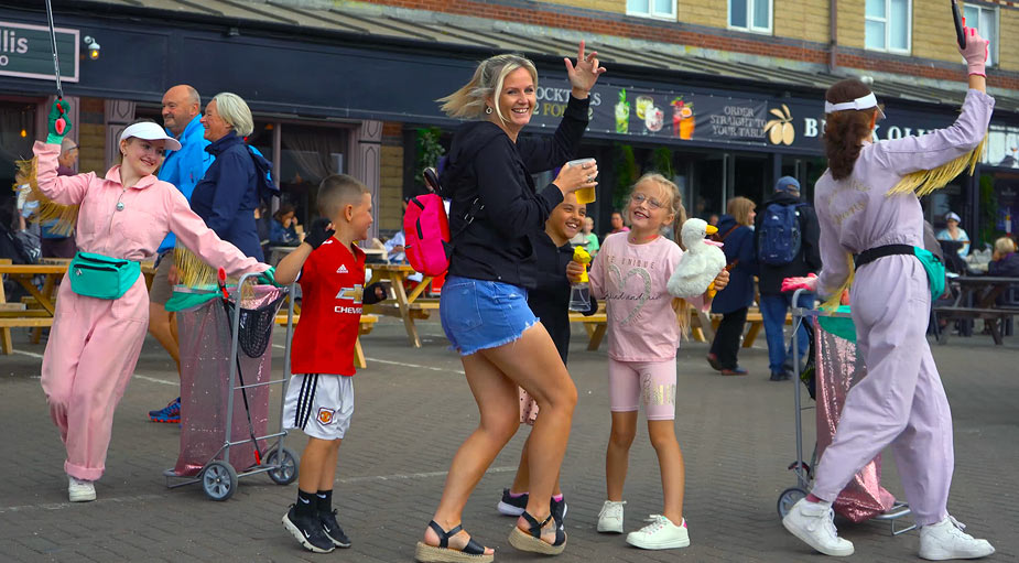 Family dancing and enjoying children's event entertainment during live coverage in Teesside