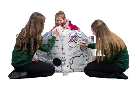 Lifestyle product photography of children colouring and engaging with activity product