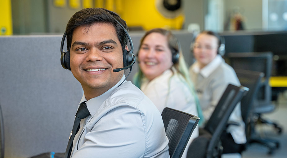 Call centre staff smiling at camera in Teesside office – corporate branding photography Stockton-on-Tees by Tees Vision Media