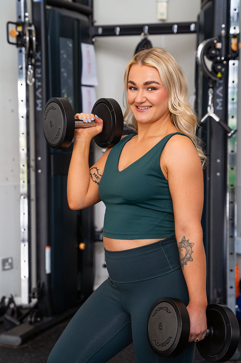 Strength Training Coach Teesside – Tees Explorer by Tees Vision Media Personal trainer lifting weights during a strength training session in Teesside