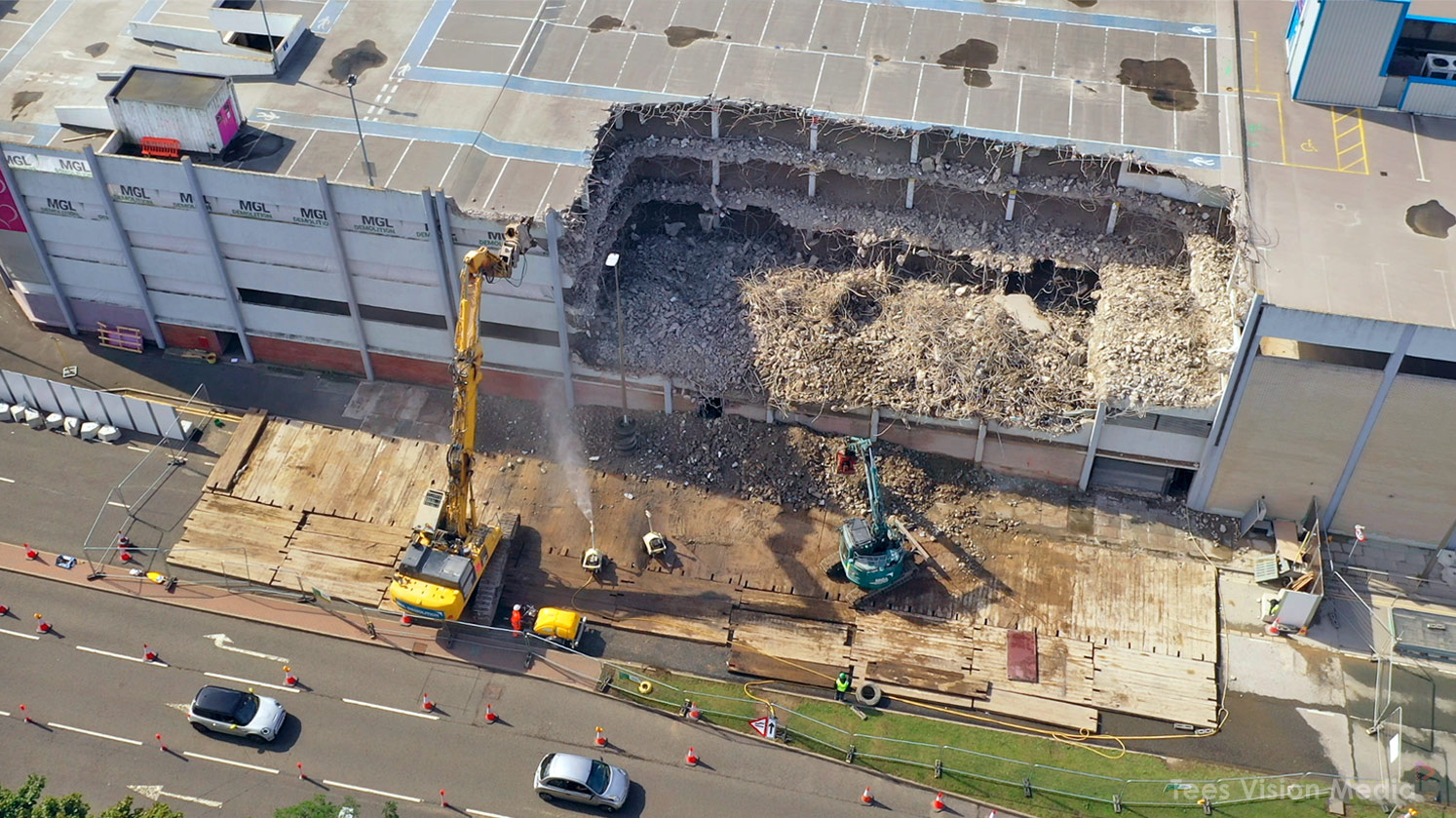 Excavators Breaking Down Castlegate Yellow excavator demolishing the upper floors of Castlegate Shopping Centre