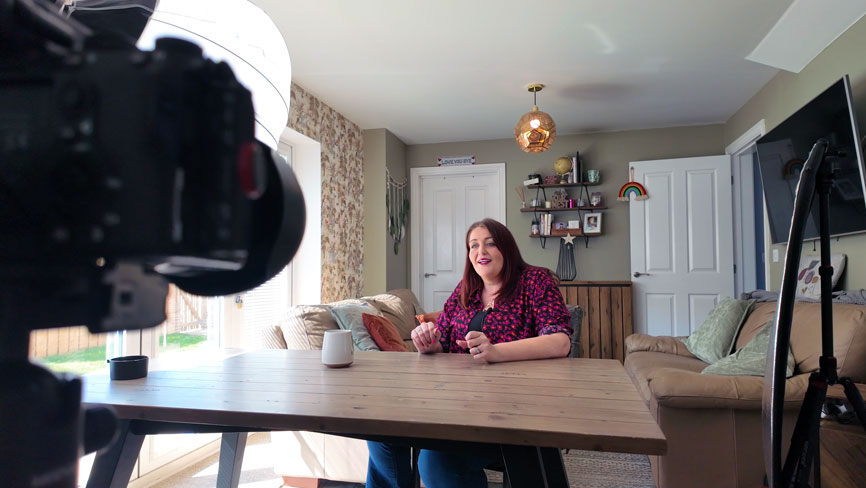 On location testimonial interview filming setup for Safespaces showing professional lighting rig and camera in a residential setting by Tees Vision Media