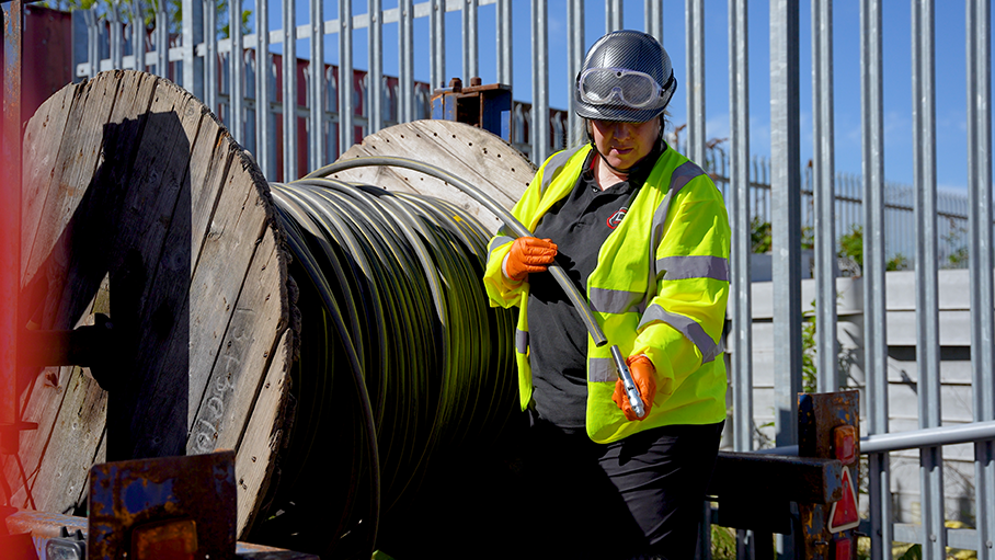 On-site photography of an engineer demonstrating technical equipment.