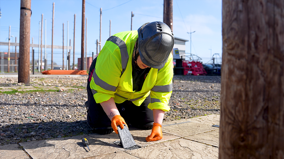 n-site photography of an engineer demonstrating technical usage guide
