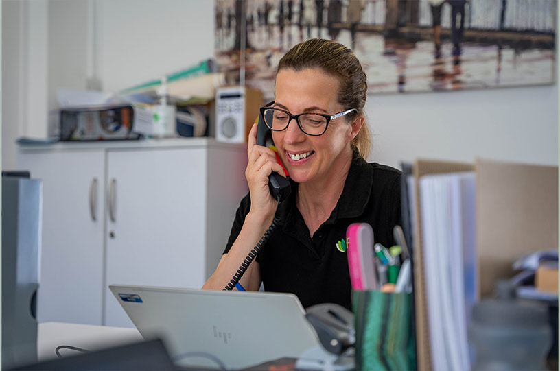 Corporate reception photography of a staff member answering the phone, Darlington